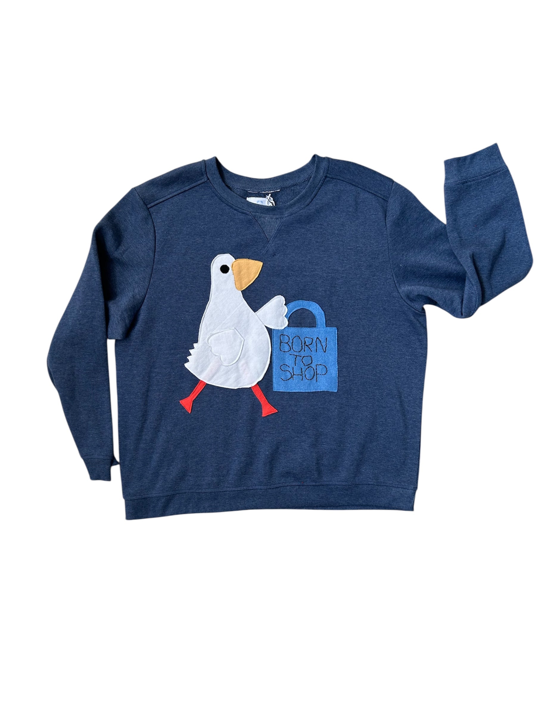 Blue sweatshirt with a cartoon duck design on a white background