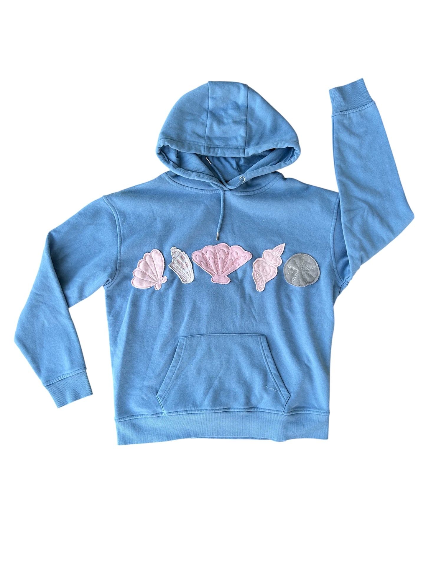 Blue hoodie with shell designs on a white background