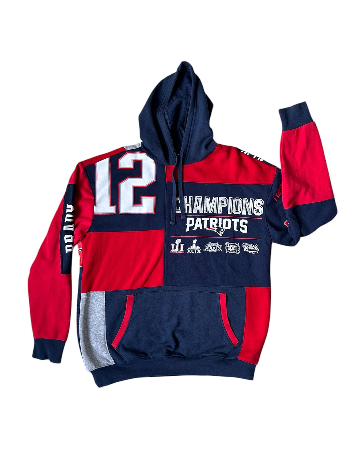 A New England Patriots reworked sweatshirt with a combination of red, blue, and white colors, featuring the number 12 and the text 'Champions Patriots'.