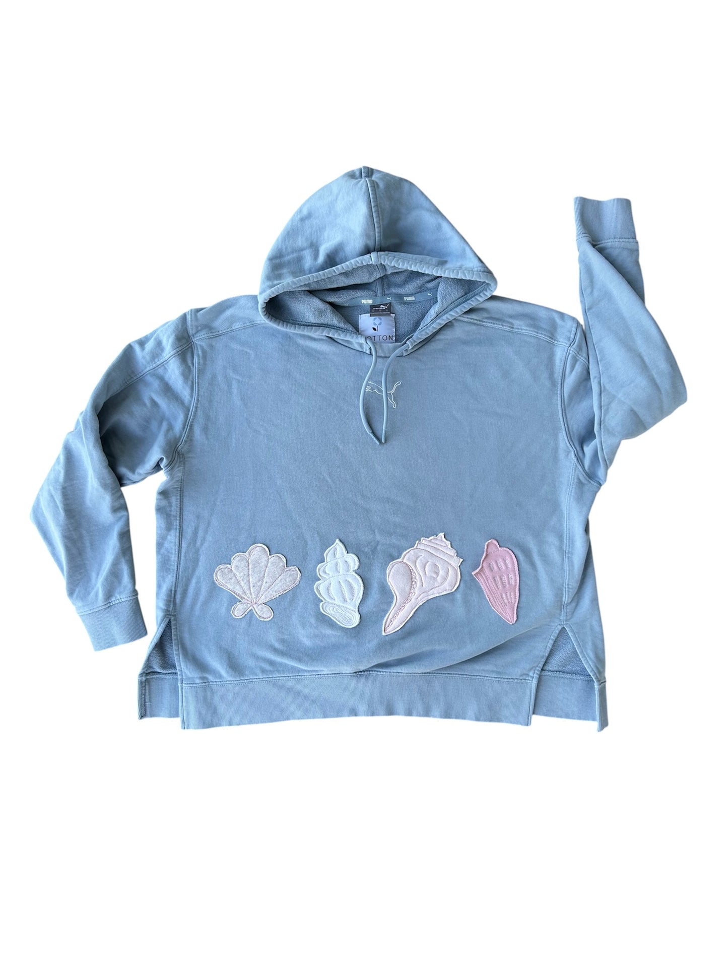 Light blue hoodie with shell designs on a white background