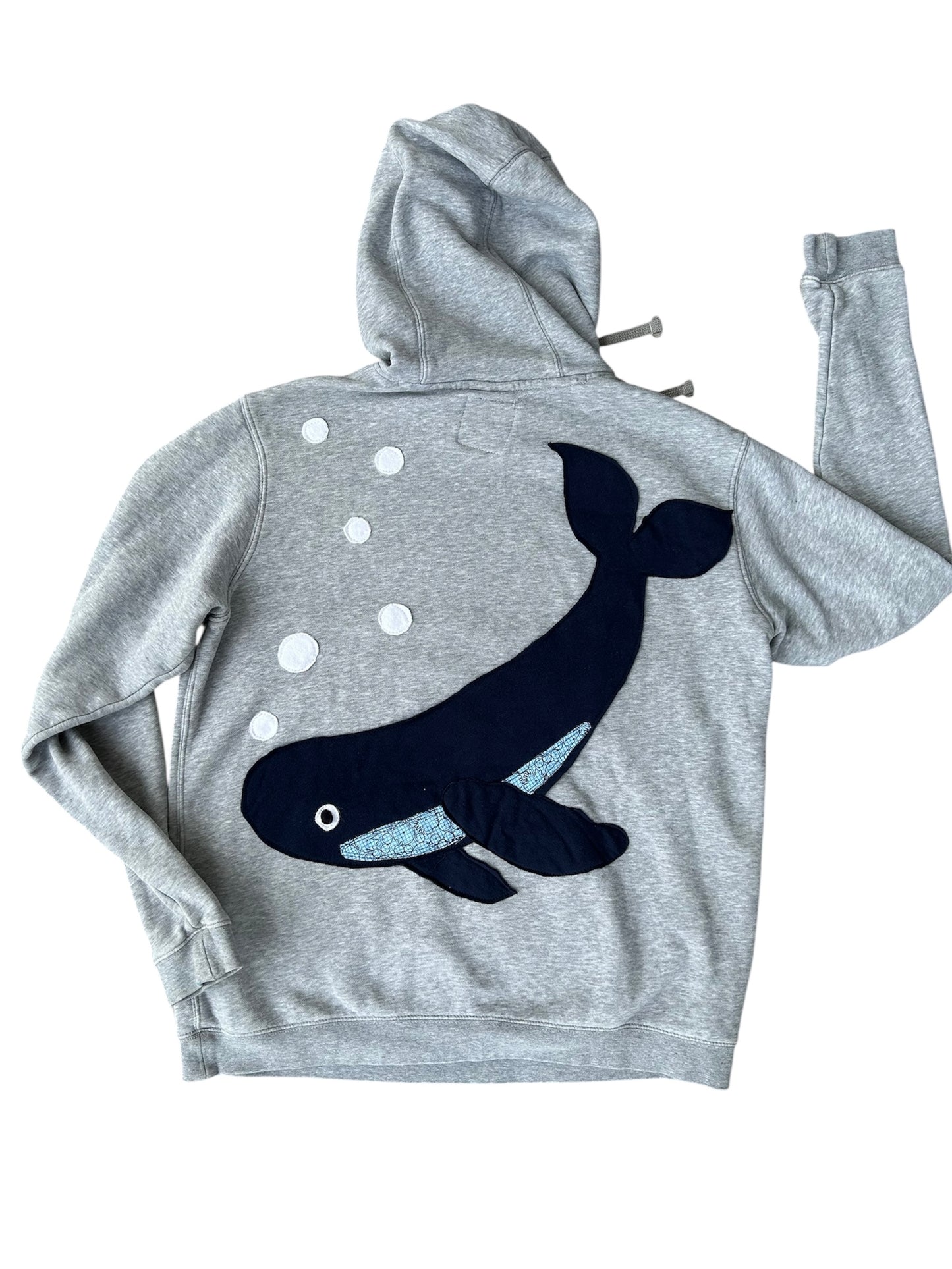 Gray hoodie with a black whale design on the back against a white background