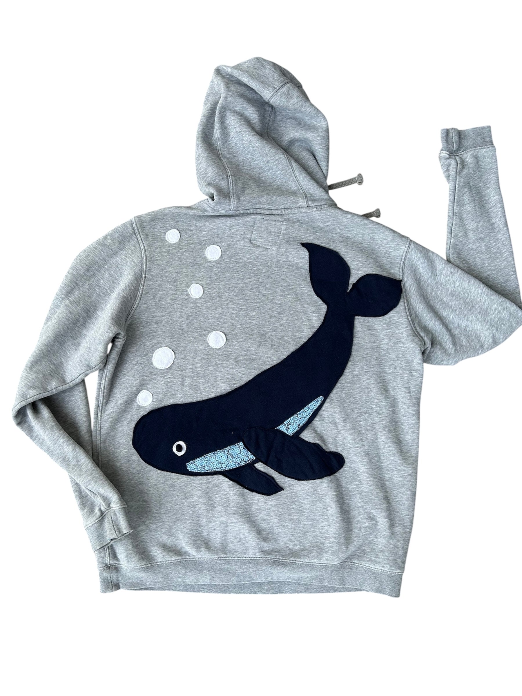 Gray hoodie with a black whale design on the back against a white background