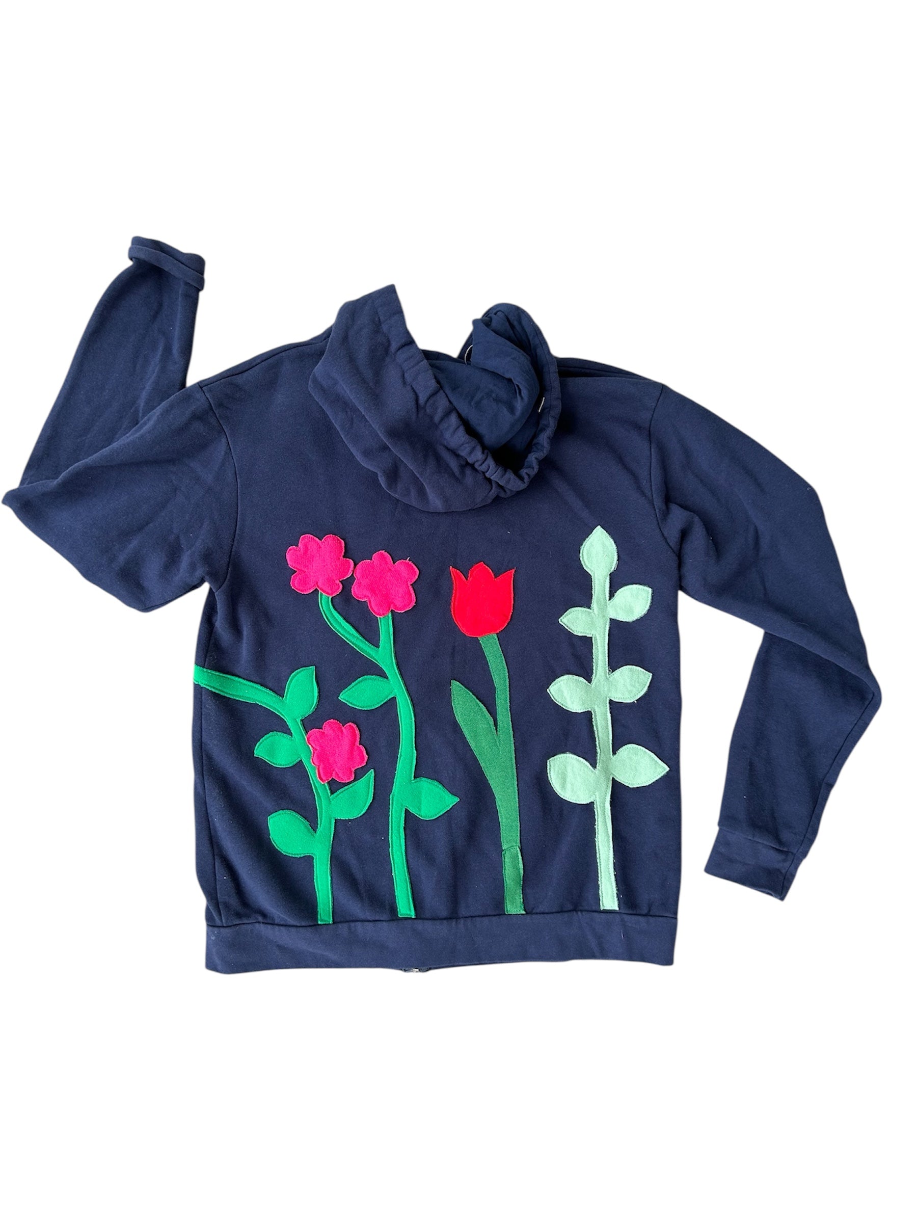 Navy blue hoodie with floral designs on a white background